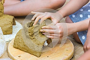 Children are doing activities clay play at home.