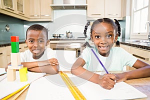 Children doing homework in the kitchen