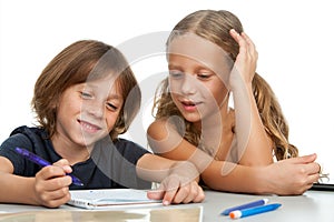 Children doing homework together.