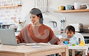 Children, down syndrome and family with a working mother and child in the kitchen of their home. Kids, disability and