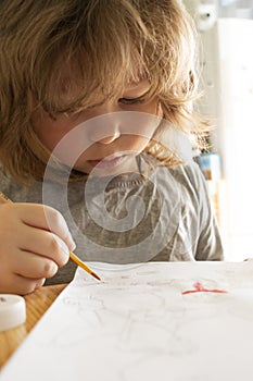 Children draw in home, Boy studying drawing at school