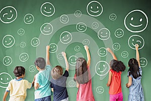 Children drawing emotion face icon on the chalkboard