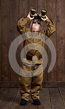 Children are dressed as soldier in retro military uniforms