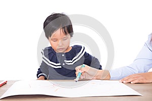 Children earnestly study drawing lessons under the guidance of the teacher