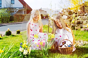 Children on Easter egg hunt with bunny