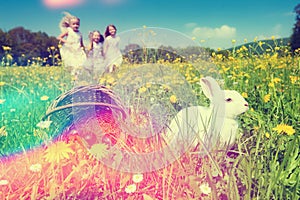 Children on Easter egg hunt with bunny