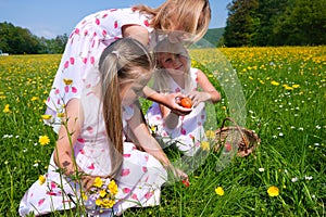 Children on Easter egg hunt with eggs