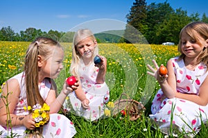 Children on Easter egg hunt with eggs