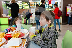 Children eat fast food