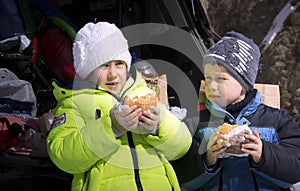 Children eat fast food.