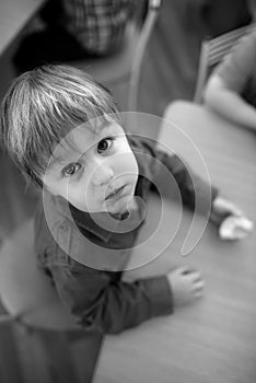 Children eating apple in kindergarten