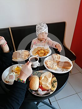 Children eating at breackfast photo