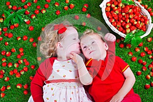 Children eating strawberry