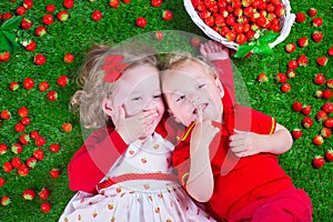 Children eating strawberry