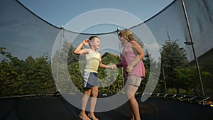 Children enjoy jumping on trampoline