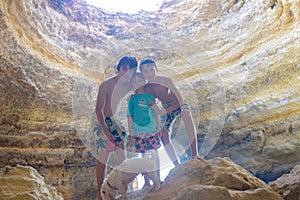 Children, enjoying Benagil, Portugal. Benagil Cave inside Algar de Benagil, famous sea cave in Algarve coast, Lagoa