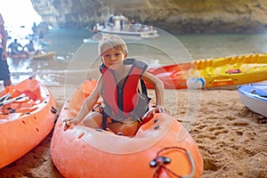 Children, enjoying Benagil, Portugal. Benagil Cave inside Algar de Benagil, famous sea cave in Algarve coast, Lagoa photo