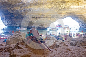 Children, enjoying Benagil, Portugal. Benagil Cave inside Algar de Benagil, famous sea cave in Algarve coast, Lagoa photo