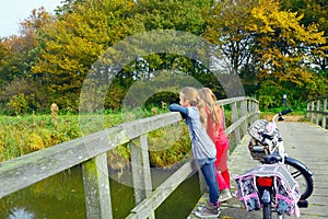 Children enjoying nature on bicycle