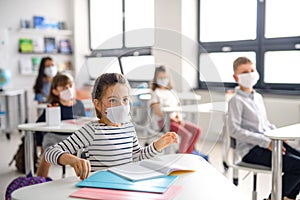 Children with face mask back at school after covid-19 quarantine and lockdown.