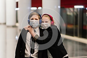 Children with face mask going back to school after covid-19 quarantine and lockdown