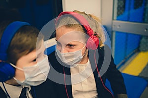 Children with face mask going back to school after covid-19 quarantine and lockdown