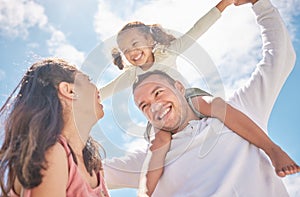 Children, family and love with a girl on the shoulders of her dad outside with her mother watching on against a blue sky