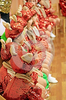 Children in fancy dresses on matinee at kindergarten