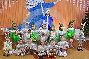 Children in fancy dresses on matinee at kindergarten