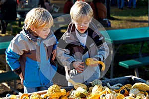 Children at Farmers Market Selecting Vegetables.