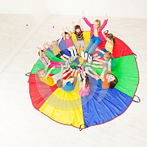 Children and female animator playing circle games