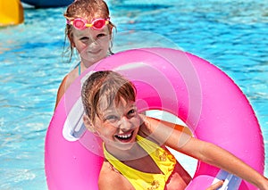 Children female swimming in pool