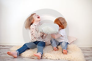 Children fight with pillows
