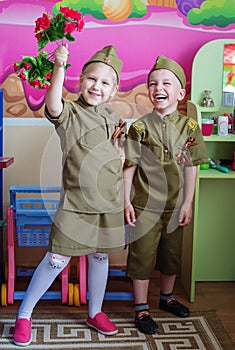 Children with flowers on the holiday of May 9, the day of victory in Russia.