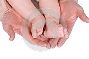 Children foot and adult hand