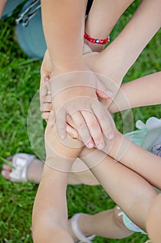 children, friends are playing in the garden, holding hands
