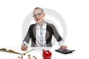 Children Frugal Concepts. Portrait of Happy Blond Teenage Girl With Coins and Moneybox. Calculating Money With Calculator For