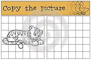 Children games: Copy the picture. Little cute baby tiger smiles. photo
