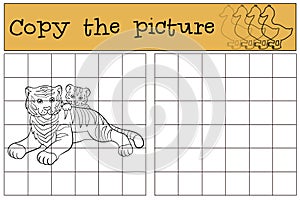 Children games: Copy the picture. Mother tiger lays with her baby photo