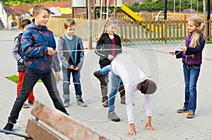 Children games. Girl goes through the tangled rope