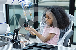 children girl with afro hairstyle robotics class for education on table at class room. learning innovation electronic for future