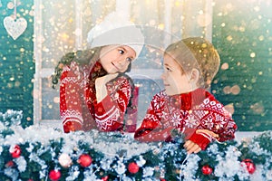 Children girl and boy waiting for Christmas, winter holidays