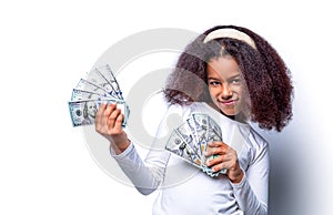 Children girl dollars 100. Smiling multiracial teenage kid girl holding hundreds of dollar money banknotes isolated