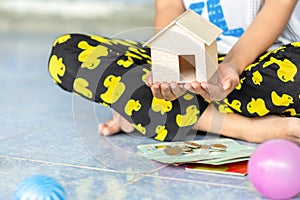 Children girl learning to saving money