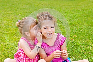 Children girl sister friends whispering ear