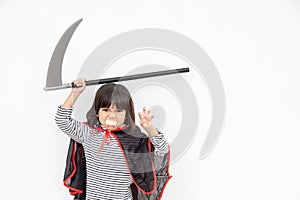 Children girl wearing mysterious Halloween dress holding a sickle on white background