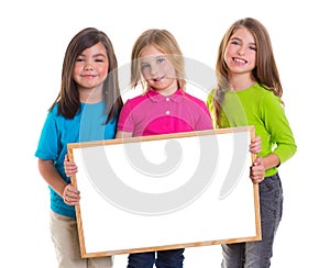 Children girls group holding blank white board copy space