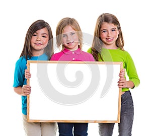 Children girls group holding blank white board copy space