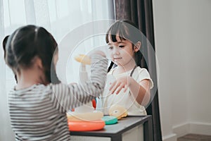 Children girls play a toy games in the room