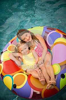 Children girls swim inner tube